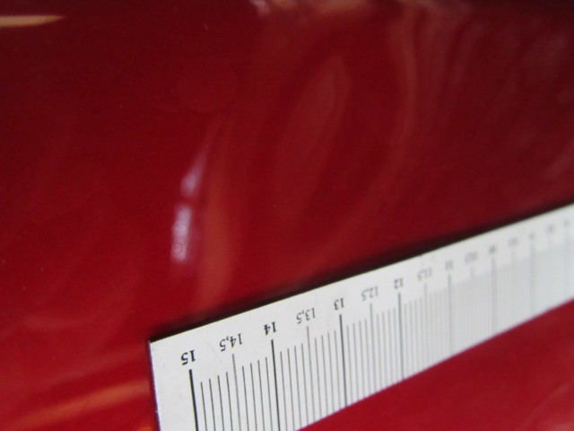 18958 Alfa Romeo Giulietta metál piros színű, bal első ajtó a képen látható sérüléssel