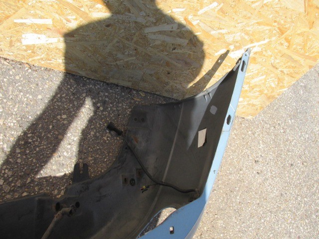 91417 Fiat Marea világos kék színű, fényszórómosó helyes első lökhárító 