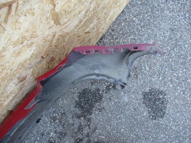 107430 Alfa Romeo MiTo hátsó lökhárító a képen látható sérüléssel 