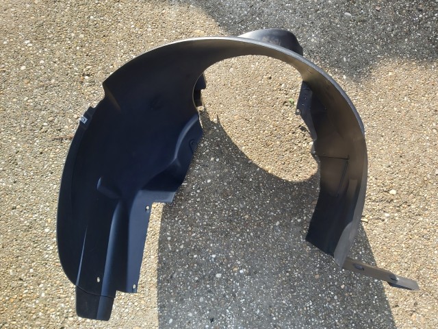 Lancia Lybra gyári új bal első kerékjárati dobbetét 46824587