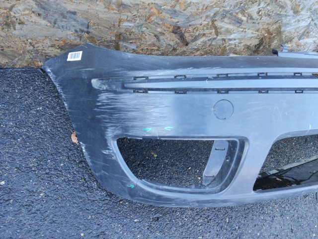 91435 Fiat Punto III. 2003-2010 szürke színű első lökhárító, a képen látható sérüléssel