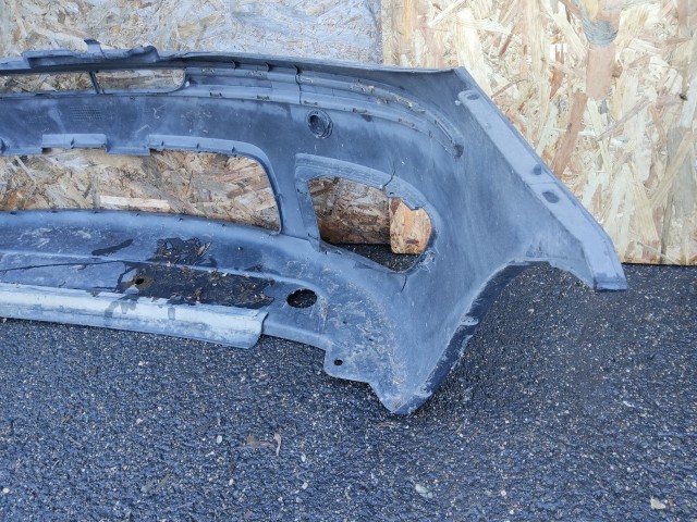 91435 Fiat Punto III. 2003-2010 szürke színű első lökhárító, a képen látható sérüléssel