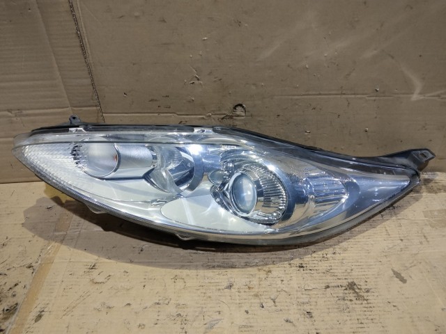 176332 Ford Fiesta 2008-2017 Lámpa , Fényszóró Használt Projektoros Bal első  a képen látható sérüléssel