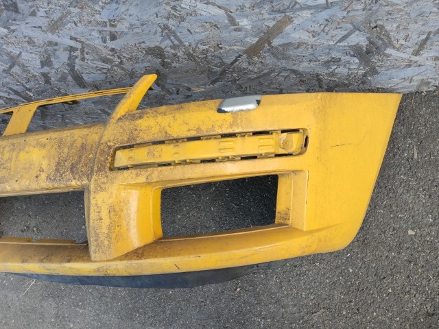 181051 Fiat Stilo 2001-2007 3 ajtós fényszórómosós első lökhárító, fényszórómosó fejekkel