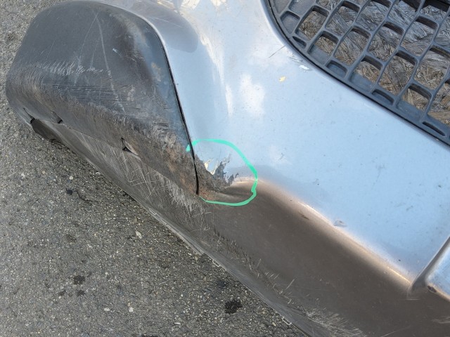 197670 Lancia Delta 2008-2014 első lökhárító, a képen látható sérüléssel 