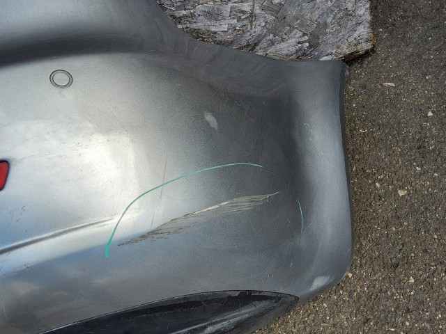 198197 Lökhárító Használt  hátsó Ezüst   a képen látható sérüléssel