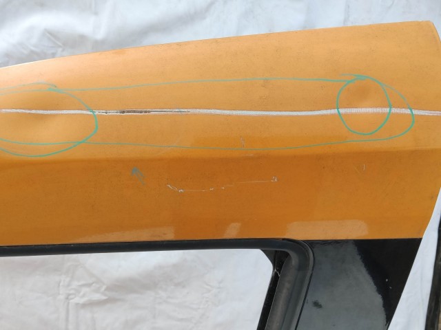 151970 Fiat Doblo 2009-2022 bal első sárga színű ajtó, a képen látható rozsdával és sérüléssel