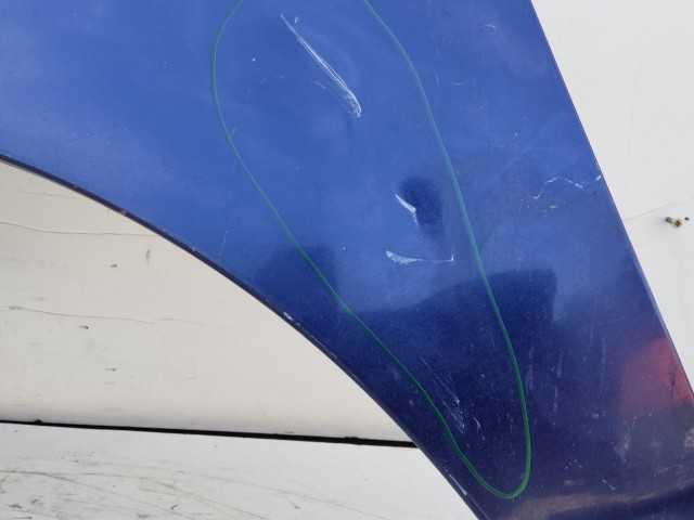 207000 Fiat Doblo II. 2005-2009 bal első sárvédő, a képen látható sérüléssel