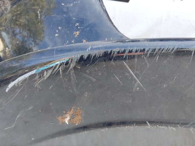 208696 Fiat Grande Punto 2005-2009 fekete színű első lökhárító, a képen látható sérüléssel