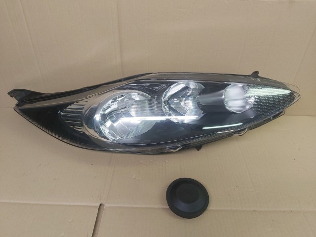 Ford Fiesta 2008-2013  utángyártott, új Fényszóró H1/H7 jobb, fekete h. (motorral) TYC