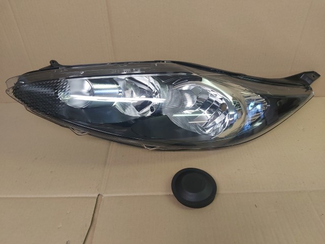 Ford Fiesta 2008-2013 utángyártott új bal első fényszóró H1/H7 fekete h. (motorral) TYC