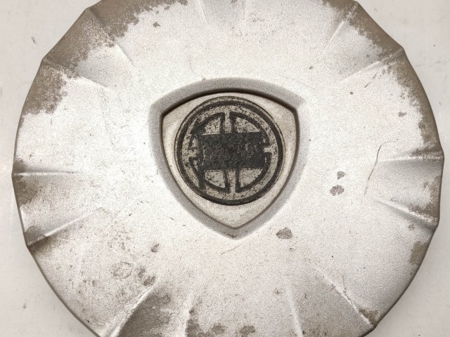 105399 Lancia Ypsilon II. 2003-2011 felni közép kupak, a képen látható állapotban